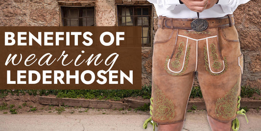 Close-up of traditional tan suede lederhosen with green embroidery, decorative belt buckle, and side lacing, highlighting the comfort, durability, practicality, and timeless style of authentic Bavarian attire