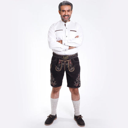 Black suede lederhosen with multicolor floral and deer embroidery, decorative side buttons and stag buckle belt