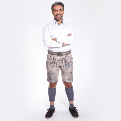 Gray lederhosen with embroidered deer and floral designs in red and blue, featuring decorative front flap and stag buckle belt