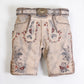 Gray lederhosen with embroidered deer and floral designs in red and blue, featuring decorative front flap and stag buckle belt