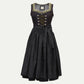 Black traditional dirndl dress with a lace-up bodice, decorative trim neckline, full skirt, and waist tie bow