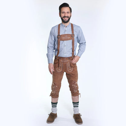 Brown suede lederhosen with embroidered detailing, front flap panel, side pocket, and adjustable suspender
