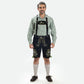 Men's black suede Lederhosen with deer and floral Bavarian embroidery, green lace-up sides, and traditional front flap