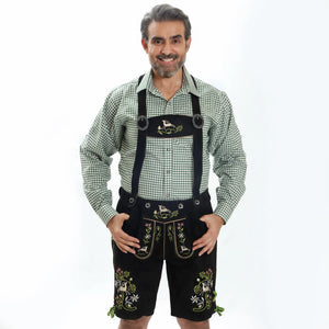 Men's black suede Lederhosen with deer and floral Bavarian embroidery, green lace-up sides, and traditional front flap
