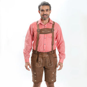 Traditional Oktoberfest outfit with light brown lederhosen, matching suspenders, a red and white checkered Trachten shirt, gray knee-high socks, and brown Haferl shoes.