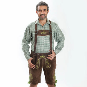 Man wearing walnut brown Lederhosen with green embroidery, checkered Bavarian shirt, knee-high socks, and traditional Haferl shoes