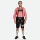 Man wearing black Lederhosen with Austrian eagle embroidery, red checkered Bavarian shirt, knee-high socks, and traditional Haferl shoes