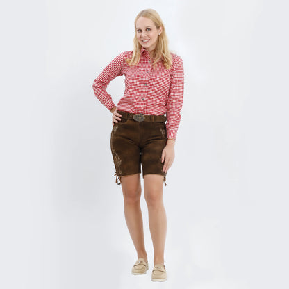 Rustic brown women lederhosen with light floral embroidery, side lace ties, and a decorative deer buckle belt