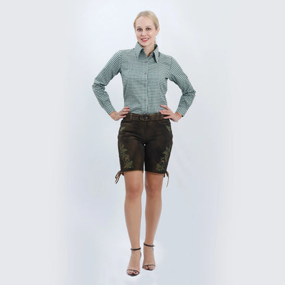 Brown women lederhosen with green embroidered deer and oak leaf motifs, side lacing, and decorative stag belt buckle