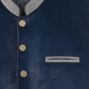 Elegant blue suede Lederhosen vest coat for men with a tailored fit, stand collar, contrasting grey trim, and decorative buttons inspired by Bavarian Trachten fashion
